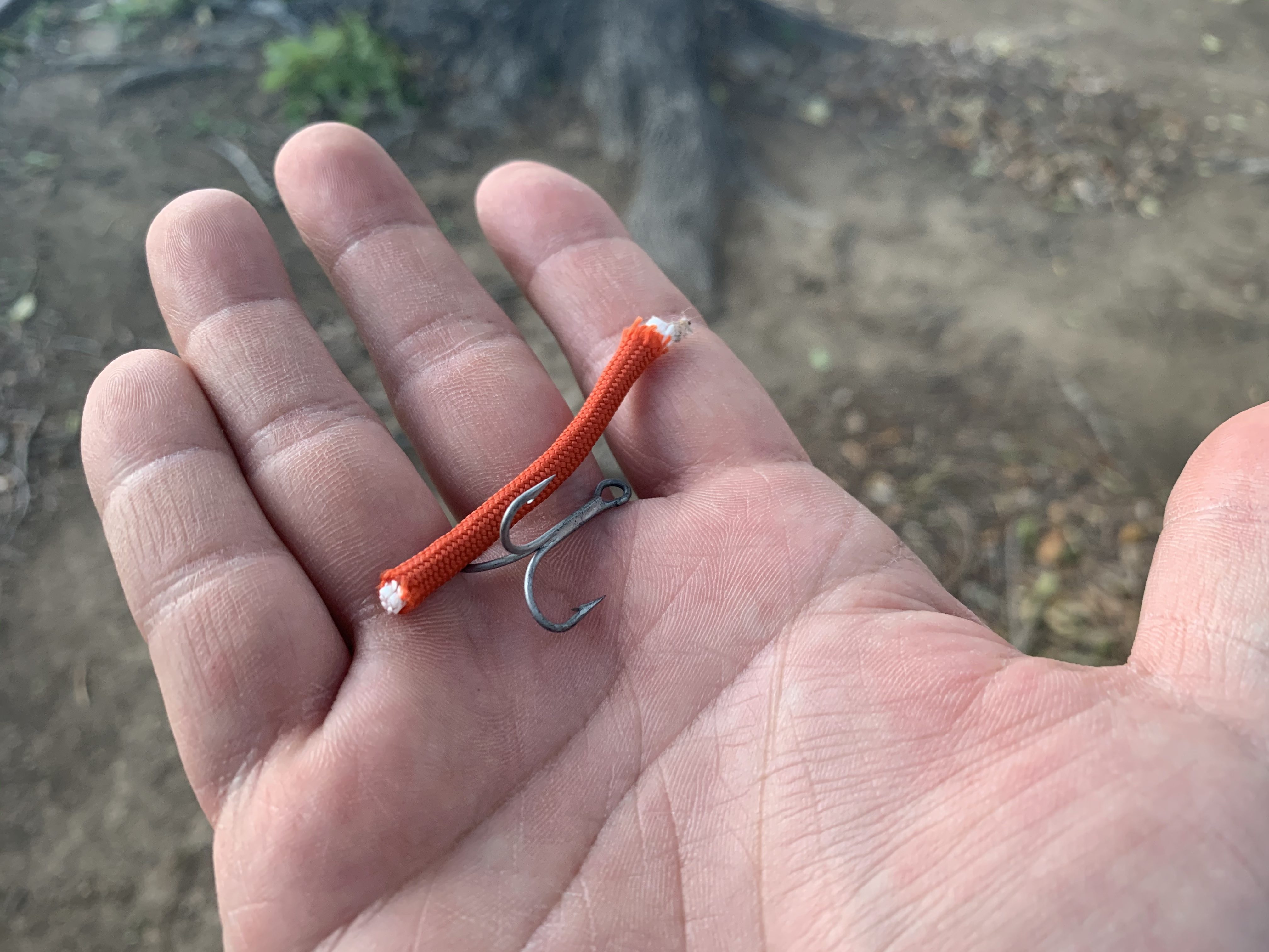 survival lure with paracord and a treble hook
